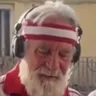 the DJ on the left, in headphones